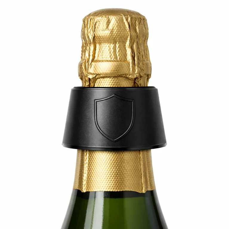 A sophisticated anodized aluminum wine tag with a matte black finish and beveled edges, highlighting a blank embossed emblem for subtle branding. This lightweight, contemporary tag is well-suited for luxury wines and champagnes.