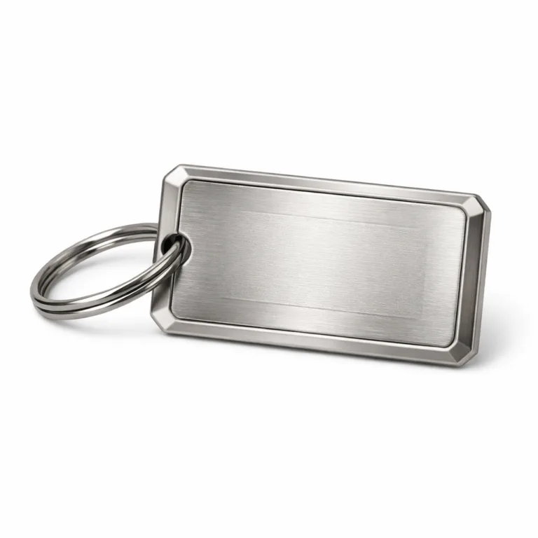 Rectangular zinc alloy luggage tag in brushed nickel, shown with beveled edge, laser-engraved blank emblem, and a classic split ring attachment. Perfect for durable personal identification on bags.