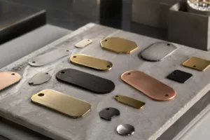 A cinematic scene featuring a collection of elegantly finished metal tags arranged to highlight luxury branding with affordable solutions. Includes anodized, brushed, and gold-plated tags on high-end products.