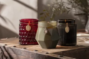 A refined visual showing how decorative metal charms enhance shelf appeal and perceived value for candle products.